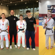 Auf dem Bild erkennt man die Kämpfer und Kämpferinnen mit ihren Coaches